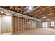 Unfinished basement with exposed ceiling and walls, framing, and exterior access at 1464 Ezra Church Nw Dr, Atlanta, GA 30314