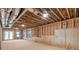 Unfinished basement with exposed framing, ductwork, and a walkout to the exterior at 1464 Ezra Church Nw Dr, Atlanta, GA 30314
