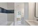 This bathroom boasts a modern tub with marble tile and a sleek vanity with dual sinks at 1464 Ezra Church Nw Dr, Atlanta, GA 30314
