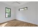 This bedroom offers modern windows, hardwood floors, and ample natural light at 1464 Ezra Church Nw Dr, Atlanta, GA 30314