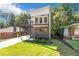 Two-story modern home with a white and gray exterior and a two-story balcony at 1464 Ezra Church Nw Dr, Atlanta, GA 30314