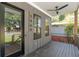 Charming front porch boasts a ceiling fan, sleek black railings, and stylish gray siding at 1464 Ezra Church Nw Dr, Atlanta, GA 30314
