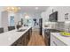 Modern kitchen with a large island, white cabinets, and stainless steel appliances at 1464 Ezra Church Nw Dr, Atlanta, GA 30314