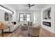 Bright living room featuring a modern fireplace, hardwood floors, and an open floor plan at 1464 Ezra Church Nw Dr, Atlanta, GA 30314