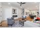 Sunlit living room with a modern fireplace, hardwood floors, and an open floor plan at 1464 Ezra Church Nw Dr, Atlanta, GA 30314