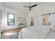 Spacious main bedroom with a neutral color scheme, modern ceiling fan, and ample natural light at 1464 Ezra Church Nw Dr, Atlanta, GA 30314