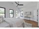 Spacious main bedroom featuring hardwood floors, large windows, and modern decor at 1464 Ezra Church Nw Dr, Atlanta, GA 30314