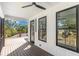 Covered porch area with wood floors, white siding, and a ceiling fan at 1464 Ezra Church Nw Dr, Atlanta, GA 30314