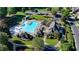 Bird's eye view of community pool with slide, seating, and well-maintained landscaping at 1530 Avalon Creek Rd, Sugar Hill, GA 30518