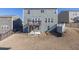 Spacious backyard featuring a deck with stairs, offering outdoor living and entertaining space, enclosed by a black metal fence at 1530 Avalon Creek Rd, Sugar Hill, GA 30518