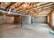 Unfinished basement with concrete floor and ceiling, utility pipes, and concrete walls at 1530 Avalon Creek Rd, Sugar Hill, GA 30518