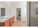 This bathroom has a double sink vanity, a large mirror and a walk-in shower at 1530 Avalon Creek Rd, Sugar Hill, GA 30518