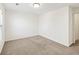 This spacious bedroom has carpeted floors, white walls, and natural lighting at 1530 Avalon Creek Rd, Sugar Hill, GA 30518
