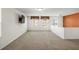 A carpeted bonus room featuring natural light and plenty of open space at 1530 Avalon Creek Rd, Sugar Hill, GA 30518