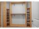 This closet has custom wood shelving, a hanging rack, and room for shoes and other accessories at 1530 Avalon Creek Rd, Sugar Hill, GA 30518