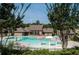 Large community pool area with beach entry, water features and ample seating for residents at 1530 Avalon Creek Rd, Sugar Hill, GA 30518