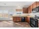 The modern kitchen is well-appointed with stainless steel appliances and abundant cabinet space for storage at 1530 Avalon Creek Rd, Sugar Hill, GA 30518