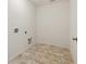 Bright and simple laundry room ready for your washer and dryer at 1530 Avalon Creek Rd, Sugar Hill, GA 30518