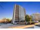 Exterior of a high-rise building with parking lot in front at 215 Piedmont Ne Ave # 1608, Atlanta, GA 30308