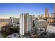City view from a building featuring surrounding buildings and a parking lot at 215 Piedmont Ne Ave # 1608, Atlanta, GA 30308