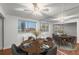Bright dining room with a modern ceiling fan, city views, and a mirrored accent wall that adds depth and style at 215 Piedmont Ne Ave # 1608, Atlanta, GA 30308