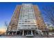Large high-rise condo building featuring many windows and a covered entry way at 215 Piedmont Ne Ave # 1608, Atlanta, GA 30308