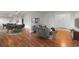 Open-concept living space with dining area and hardwood floors at 215 Piedmont Ne Ave # 1608, Atlanta, GA 30308