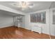 Bright living room with hardwood floors, city views, and two wall heaters at 215 Piedmont Ne Ave # 1608, Atlanta, GA 30308