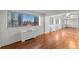Bright living area with hardwood floors and floor to ceiling windows at 215 Piedmont Ne Ave # 1608, Atlanta, GA 30308