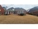 Spacious backyard featuring a well-maintained lawn and a cozy patio area at 2604 Harman Park Cir, Duluth, GA 30097