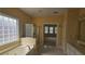 Well-lit primary bathroom with a soaking tub, a glass shower, and double sinks at 2604 Harman Park Cir, Duluth, GA 30097