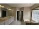 Bright bathroom with double sinks, a large mirror, and separate tub and shower at 2604 Harman Park Cir, Duluth, GA 30097
