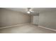 Bright, carpeted bedroom with neutral colors and several doors, creating a comfortable living space at 2604 Harman Park Cir, Duluth, GA 30097