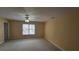 A serene bedroom with soft lighting and a large window overlooking the neighborhood at 2604 Harman Park Cir, Duluth, GA 30097