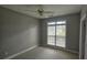 Bedroom with neutral-toned walls, carpet flooring, window, and ceiling fan at 2604 Harman Park Cir, Duluth, GA 30097