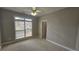 Cozy bedroom featuring a window with natural light and neutral carpet at 2604 Harman Park Cir, Duluth, GA 30097