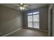 Bedroom with neutral-toned walls, carpet flooring, window, and ceiling fan at 2604 Harman Park Cir, Duluth, GA 30097