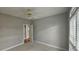 Bedroom featuring neutral walls, carpet flooring, a window and an open door at 2604 Harman Park Cir, Duluth, GA 30097