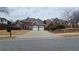 Charming single-story brick home features a manicured lawn and two-car garage at 2604 Harman Park Cir, Duluth, GA 30097