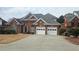 Attractive brick home with a well-kept lawn and a convenient two-car garage at 2604 Harman Park Cir, Duluth, GA 30097