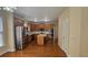 Kitchen featuring wooden cabinets, a kitchen island, stainless appliances, and hardwood flooring at 2604 Harman Park Cir, Duluth, GA 30097