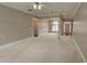 Open-concept living room featuring neutral color palette, crown molding, and abundant natural light at 2604 Harman Park Cir, Duluth, GA 30097