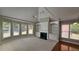 Spacious living room featuring a fireplace, built-in shelving, and large windows for ample natural light at 2604 Harman Park Cir, Duluth, GA 30097