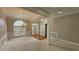 Living room with carpet, chandelier and large windows for lots of natural light at 2604 Harman Park Cir, Duluth, GA 30097