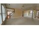 Open-concept living room featuring large windows, neutral carpet, and classic architectural details at 2604 Harman Park Cir, Duluth, GA 30097