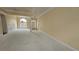 Spacious living room area with carpet, large windows, and architectural columns at 2604 Harman Park Cir, Duluth, GA 30097