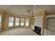 Bright living room featuring a fireplace, large windows, and high ceilings at 2604 Harman Park Cir, Duluth, GA 30097