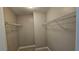Walk-in closet featuring built-in wire shelving for organized storage at 2604 Harman Park Cir, Duluth, GA 30097