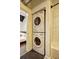 Bathroom featuring in-unit laundry and decorative flooring at 260 18Th Nw St # 10302, Atlanta, GA 30363