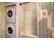 Bathroom featuring a tub and in-unit laundry at 260 18Th Nw St # 10302, Atlanta, GA 30363